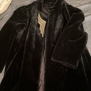 Vintage faux fur coat. Black with faux leather adornment at the lapel.